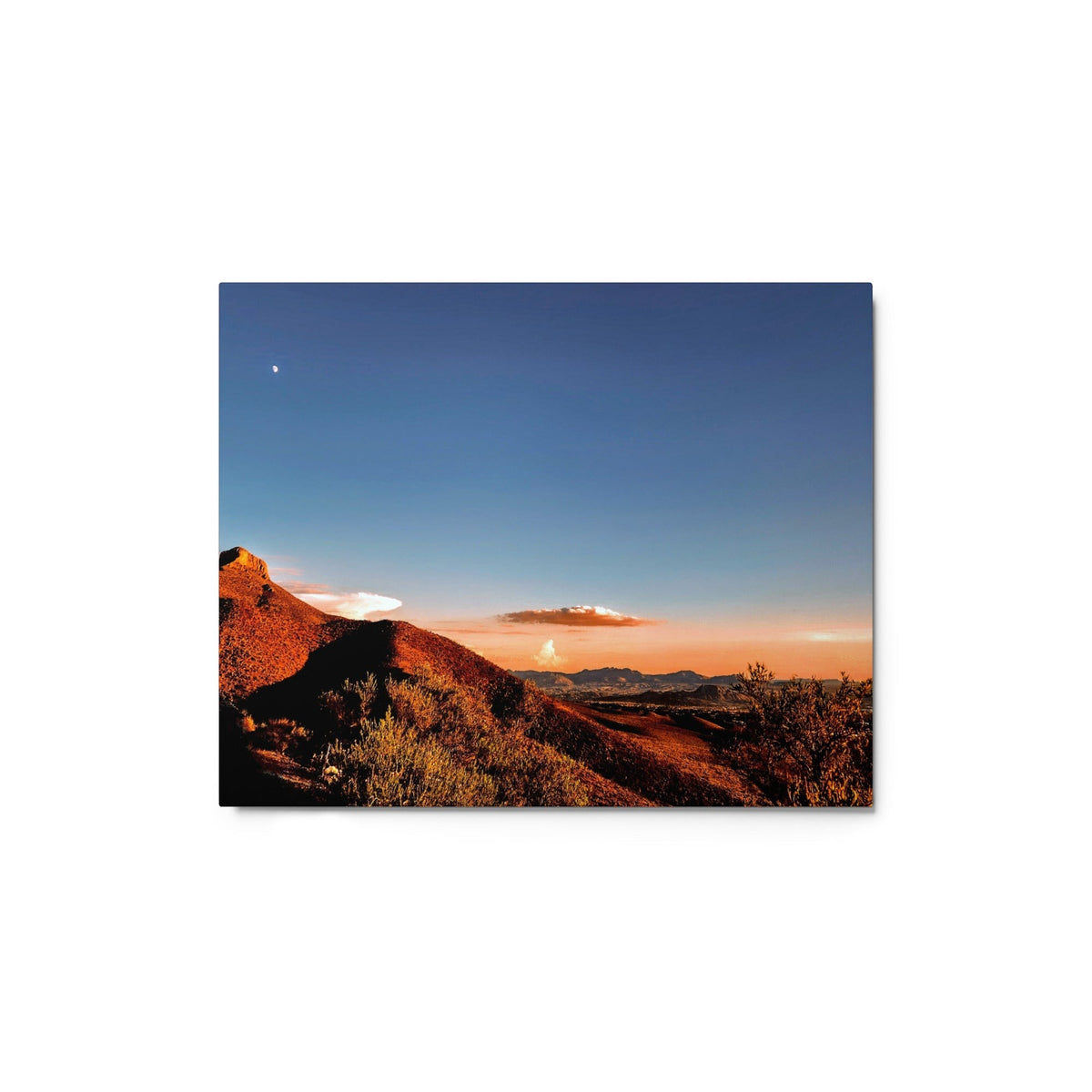 Metal print featuring a vibrant desert landscape at sunset with a clear blue sky and crescent moon.